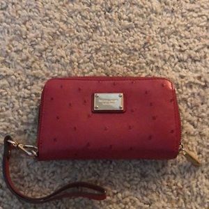 Red Michael Kors wristlet.